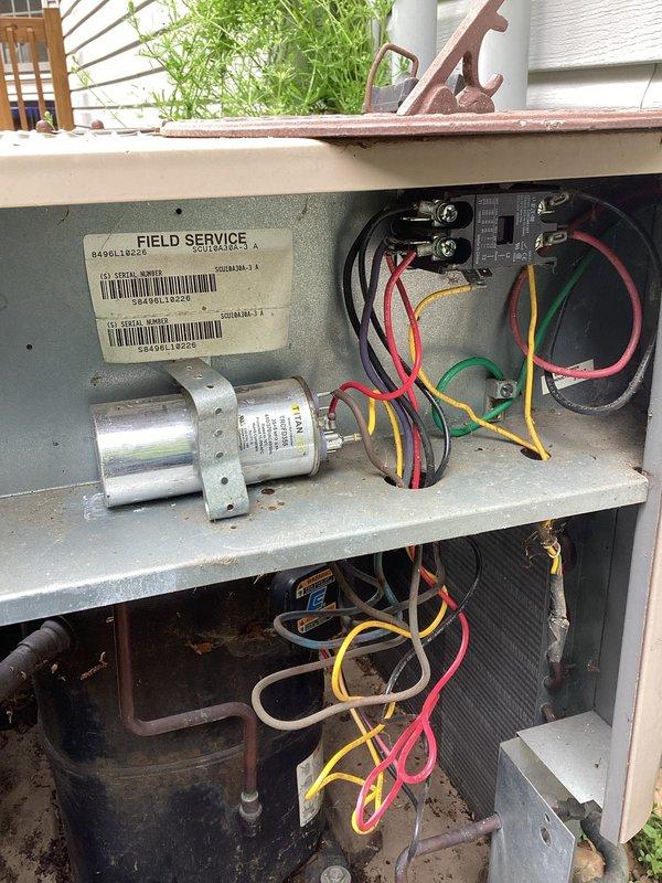 Completed planned air conditioning maintenance on outdoor condensing unit. Performed comprehensive system inspection with access panel removed to evaluate internal components including capacitor, electrical connections, and wiring integrity. Connected refrigerant gauges via service hoses to assess system pressures and verify proper refrigerant charge levels. All electrical connections, compressor, and copper refrigerant lines inspected and found operational.