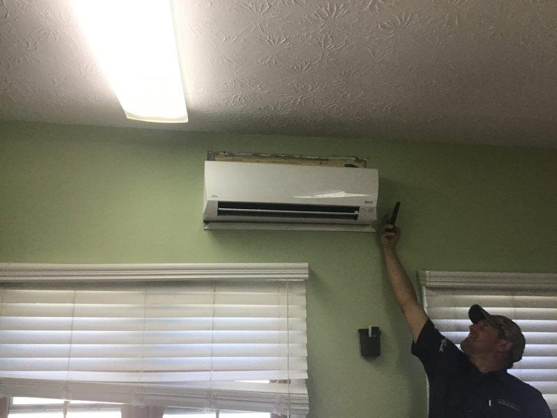 Provided estimate for ductless mini-split system installation in nurses lounge area. Assessed existing space with wall-mounted indoor unit requirements and evaluated exterior location for outdoor condenser placement on concrete pad with refrigerant line set routing through brick exterior wall.