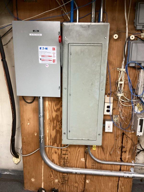 Responded to no-cooling call on residential HVAC system approximately 10 years old. Upon arrival, confirmed system was clicking but failing to start with no airflow through vents and no tripped breakers. Performed diagnostic evaluation of electrical components at disconnect switch and main panel, inspected furnace unit and associated condensate lines, and examined all visible electrical connections and control circuits to identify failure point preventing compressor and blower operation.