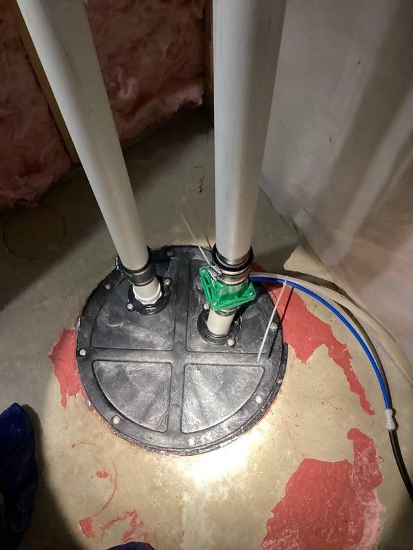Responded to service call for odor emanating from groundwater sump pump system. Upon investigation, identified sump pump operational but discovered deteriorating water heater tank with significant rust and paint degradation in proximity to sump basin, which was contributing to moisture and odor issues in the utility area. Inspected associated plumbing connections including PVC discharge lines and verified pump cycling functionality. Documented existing water filtration system and storage tank configuration to assess potential impact on overall drainage and humidity conditions. Recommended water heater replacement due to advanced corrosion and potential failure risk, along with improved ventilation to mitigate ongoing odor concerns in the sump pump area.