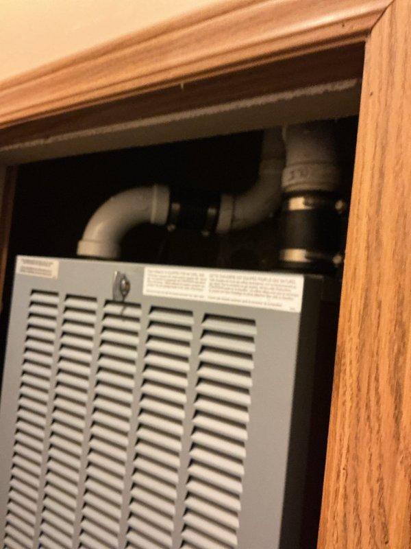 Completed full HVAC system installation including HUD furnace with matching evaporator coil, Lennox air conditioning unit, and Honeywell T4 Pro programmable thermostat. Installed all equipment per manufacturer specifications, connected refrigerant lines, and routed condensate drainage using PVC piping. Verified system operation with supply air temperature reading of 128°F at floor register, confirming proper heating function. All components tested and operational upon completion.