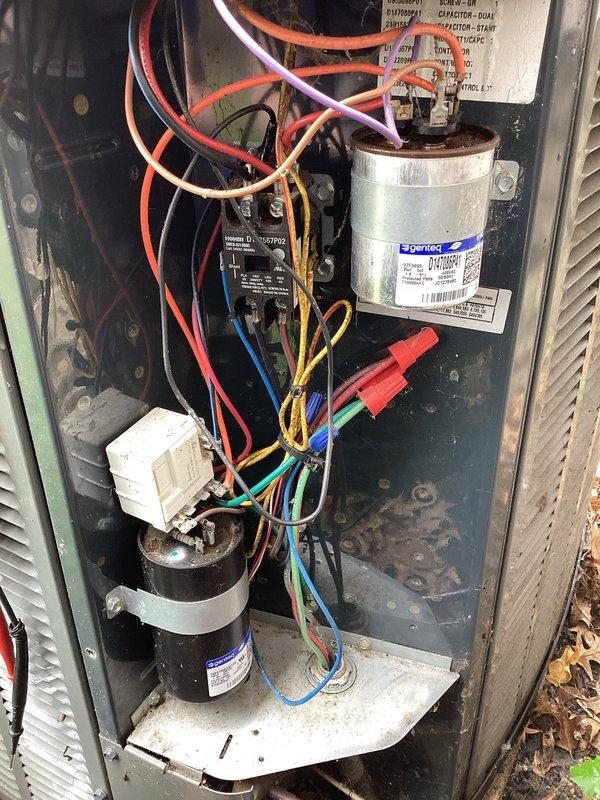 Completed planned maintenance inspection on outdoor air conditioning unit as part of recurring HVAC membership service. Accessed electrical compartment and inspected all major components including Genteq capacitor, contactor relay, wiring connections, and compressor motor. Unit interior showed significant accumulation of dirt, debris, cobwebs, and organic matter throughout compartment, indicating extended operation without recent maintenance. All electrical connections, capacitor, and contactor were visually inspected and found to be functional despite heavy soiling conditions.