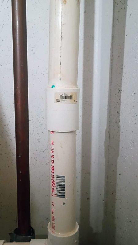 Responded to a broken fitting on the sprinkler system piping in the basement. Upon arrival, confirmed the water supply was already shut off and no active leaking or property damage was present. Inspected the PVC sprinkler line assembly, including the gate valves, connections, and vertical pipe configuration. Documented the existing plumbing installation showing the white PVC piping system with red valve handles and the connection points where the fitting failure occurred. Provided assessment and recommendations for repair of the damaged fitting to restore the sprinkler system to proper working condition.