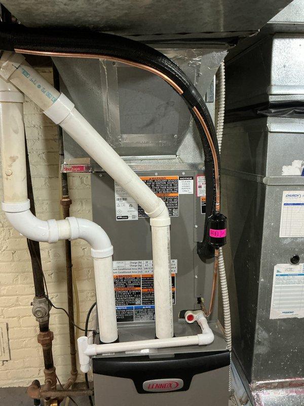 Completed first-time installation of Lennox air conditioning system with outdoor condensing unit and indoor evaporator coil. Installed refrigerant lines with proper insulation, established electrical connections, and integrated new A/C system with existing furnace and ductwork. Reused existing thermostat for system control, verified proper refrigerant charge, tested system operation, and confirmed cooling functionality throughout the home.