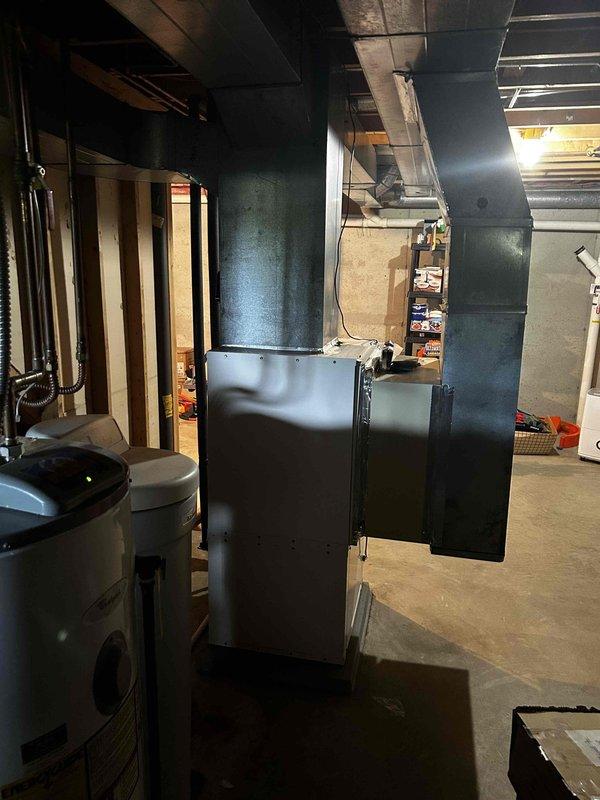Upon arrival, diagnosed geothermal system not operating as designed due to critically low R22 refrigerant at 30 psi, causing inline low pressure switch to open. Additionally found drain line completely plugged and cleared obstruction. Per homeowner request, recharged system and added sealant to slow refrigerant leaks. After service, verified system operating with 20-degree temperature drop and 12-degree superheat. Recommended complete system replacement due to age and refrigerant loss issues. Documented existing HVAC equipment and infrastructure with photos.