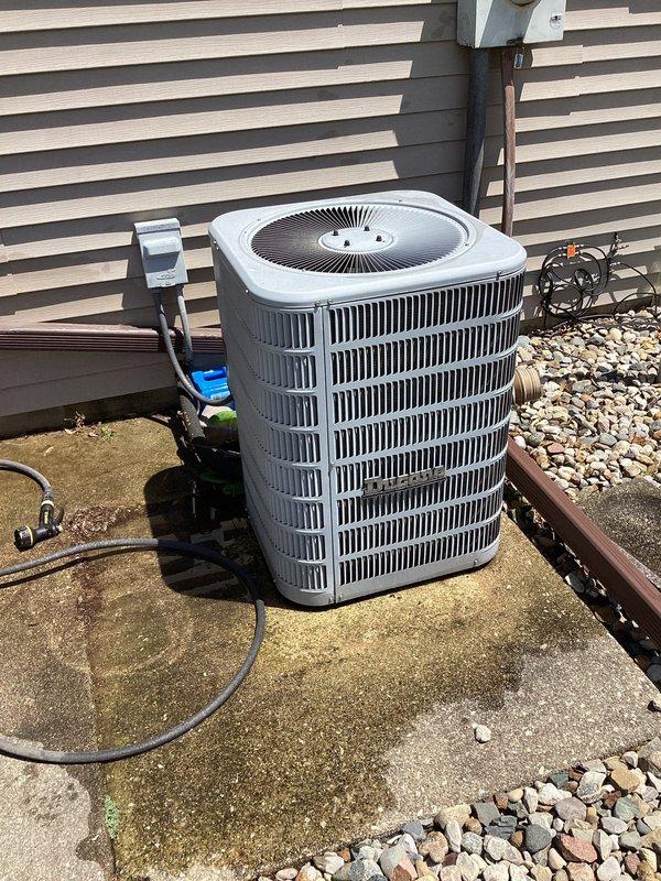 # HVAC Maintenance - Planned Single Maintenance

Completed scheduled air conditioning maintenance per membership agreement. Performed comprehensive system inspection of outdoor condensing unit, verifying proper operation of compressor, condenser fan motor, and electrical components. Inspected capacitor condition and electrical connections, confirming all wiring terminals secure and within manufacturer specifications. Evaluated condenser coil fins for damage and airflow restriction—unit showed good condition with clean, intact fins allowing proper heat transfer. Checked refrigerant lines, electrical disconnect, and mounting stability on concrete pad. Documented system condition with interior compartment and exterior unit photos showing capacitor, relay components, wiring connections, and overall equipment status. Unit operating normally with no deficiencies noted at time of service.