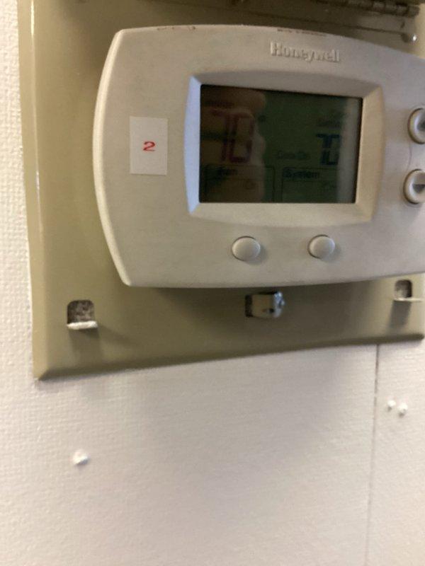 Responded to no cooling complaint on 7-year-old system with indoor temperature at 80°F. Performed diagnostic evaluation of dual HVAC system, as property had previous repair completed on one unit. Inspected thermostat operation and verified settings at 72°F setpoint, checked system response and airflow at registers, and assessed overall system performance to identify which unit was experiencing the cooling failure.