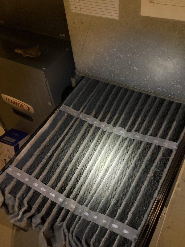 Responded to no cooling complaint on 16-year-old residential HVAC system. Upon arrival, found indoor blower operating but inadequate cooling to occupied space. Inspection revealed severely restricted airflow due to heavily clogged air filter with substantial dust and debris accumulation throughout pleated media. Filter obstruction was causing significant reduction in system airflow, preventing proper heat exchange at evaporator coil and resulting in insufficient cooling capacity. Replaced dirty filter with new unit to restore proper airflow. Verified return air grille condition and cleared accumulated dust from vent components. System airflow restored to normal operation, allowing adequate cooling performance to resume.