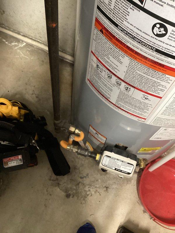 Responded to service call for non-operational 4-year-old tanked water heater with no reported leaking. Upon arrival, performed diagnostic inspection of the unit and associated plumbing connections, including copper piping, brass fittings, pressure relief valve, and expansion tank. Evaluated electrical connections and water heater controls to identify cause of failure. Documented existing installation configuration with photographs showing system components and overall condition of the unit for service records.