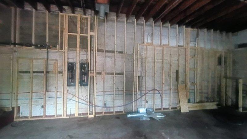 Completed installation of tanked water heater in unfinished basement area with new plumbing connections, including copper supply lines with ball valve shut-off controls and PEX tubing integration. All connections were secured to wall framing with proper mounting brackets, system tested and verified operational, with final balance collected upon completion.