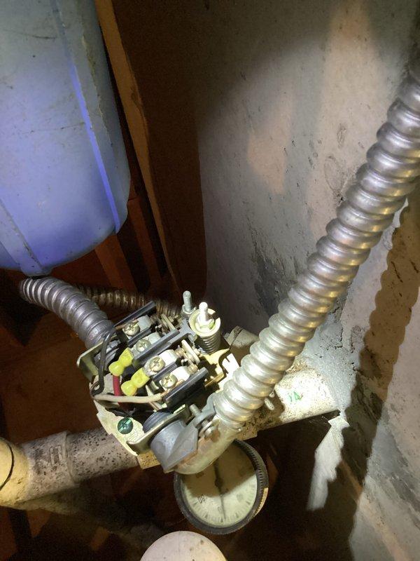 Responded to no-water emergency at 35-year-old residence following recent storms. Upon arrival, confirmed complete loss of water supply throughout home affecting all fixtures and toilets. Investigated well system components in basement utility area, inspecting pressure tank, pressure switch, electrical connections, and control wiring. Found pressure switch contacts required attention and verified proper electrical supply to well pump contactor. Restored water service to full system functionality with all fixtures and toilets operating normally.

Additionally performed scheduled preventive maintenance on 2-year-old air conditioning system. Completed standard tune-up procedures including inspection of electrical connections, refrigerant pressures, condenser coil condition, and overall system operation. Unit found in good working order with no deficiencies noted. System operating within manufacturer specifications.