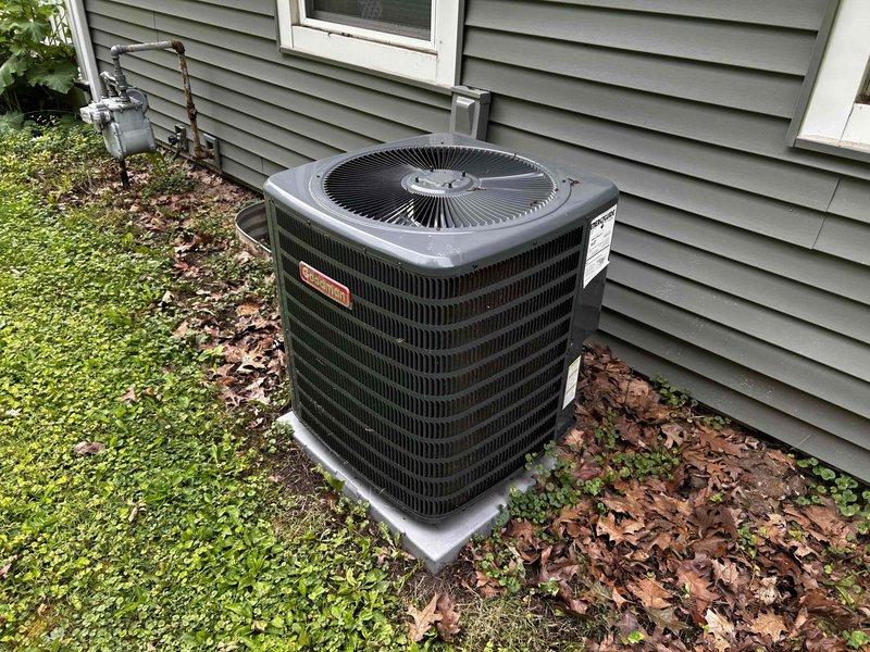 Provided estimate for temporary removal and reinstallation of existing furnace system to facilitate water damage remediation work in basement area. Documented current HVAC equipment configuration including outdoor Goodman condenser unit and basement furnace installation with associated electrical connections, refrigerant lines, and utility routing through floor joists. Quote covers disconnection of all electrical and mechanical connections, safe removal of furnace unit from work area, protection of equipment during remediation process, and complete reinstallation with reconnection of all systems upon completion of water damage repairs.