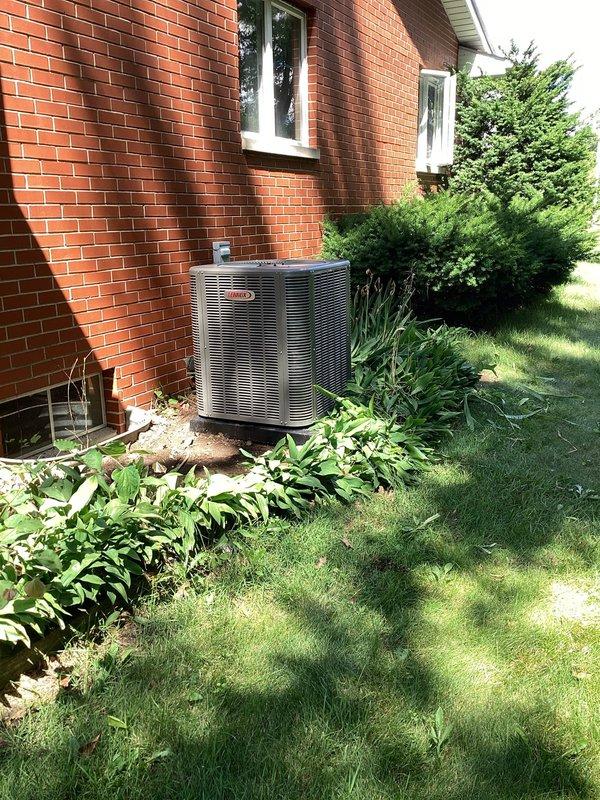 Completed full HVAC system installation including Lennox ML196UH090 high-efficiency modular gas furnace, ML13KC-1036 outdoor condensing unit, CK40CT-30B evaporator coil, and T4 thermostat. Positioned exterior condenser unit on concrete pad against residential brick structure with proper clearances for airflow and service access, connected refrigerant lines and electrical service to manufacturer specifications. Installed furnace and evaporator coil in basement mechanical room with proper venting using PVC piping, integrated gas supply line connections, established condensate drainage, and completed all ductwork modifications for optimal system performance. Verified all electrical connections, tested system operation through complete heating and cooling cycles, confirmed proper refrigerant charge and airflow measurements, and programmed thermostat for efficient climate control.