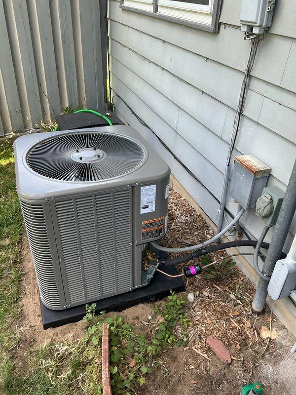 Completed installation of Lennox ML17KC2-036 air conditioning condenser unit and CK40CT-30B coil at residential property. Positioned outdoor condenser on plastic pad against exterior wall with proper clearances, connected refrigerant lines with insulated line set, and established electrical connections to existing disconnect. Reused existing thermostat and verified system operation upon startup. All components tested and confirmed operational per manufacturer specifications.