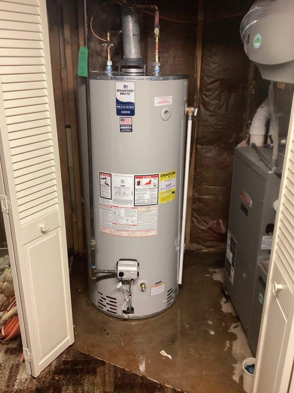 Conducted remote estimate assessment for water heater replacement on a Bradford White 75-gallon gas-fired automatic storage water heater (Model BDT2TL5, 76,000 BTU). Photographic documentation revealed significant water damage and moisture staining on concrete floor surrounding unit base, indicating active or recent leaking condition. Reviewed unit specifications including tank capacity, BTU rating, and venting configuration to provide accurate replacement quote via phone consultation.