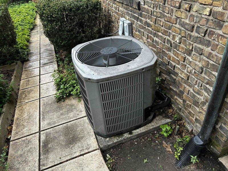 Evaluated existing HVAC system with failed air handler motor in basement utility space and outdoor condensing unit. Documented equipment dimensions and clearances for replacement system, noting 68.5" vertical clearance and adequate horizontal spacing for new air handler installation. Provided comprehensive estimate for complete HVAC system replacement including new air handler and condensing unit to restore heating and cooling functionality.