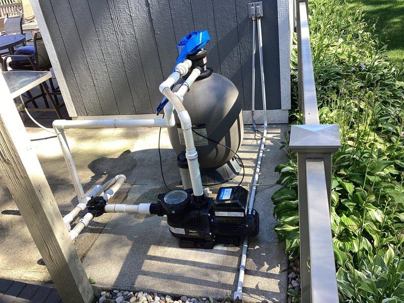 Completed site assessment and provided estimate for installation of approximately 100 feet of natural gas line to supply new inground pool heater. Evaluated existing pool equipment area including pump, filtration system, and pressure tank mounted on concrete pad adjacent to wooden deck. Assessed routing requirements from main gas supply near building foundation through landscaped areas to pool equipment location. Documented existing utility infrastructure including copper water lines and electrical connections to determine optimal path for gas line installation while maintaining proper clearances and code compliance.