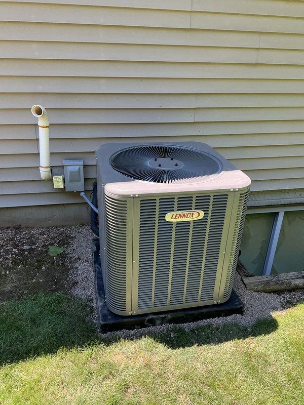 Completed installation of new Lennox air conditioning system consisting of ML13KC1-030 outdoor condensing unit and CK40CT-30B indoor evaporator coil. Positioned condenser on protective pad adjacent to home exterior with proper clearances maintained. Established refrigerant lines between outdoor and indoor components. Reused existing thermostat to maintain customer preference and reduce installation costs. Performed proper refrigerant recovery procedures using recovery machine and storage tank prior to system startup. Evacuated system to remove moisture and non-condensables from refrigerant lines. Charged system with appropriate refrigerant type and quantity per manufacturer specifications. Installed condensate drain piping with PVC materials, routing discharge away from foundation. Verified electrical connections at disconnect and unit terminals. Tested system operation including compressor function, fan motor performance, and overall cooling capacity. Confirmed proper airflow and temp
