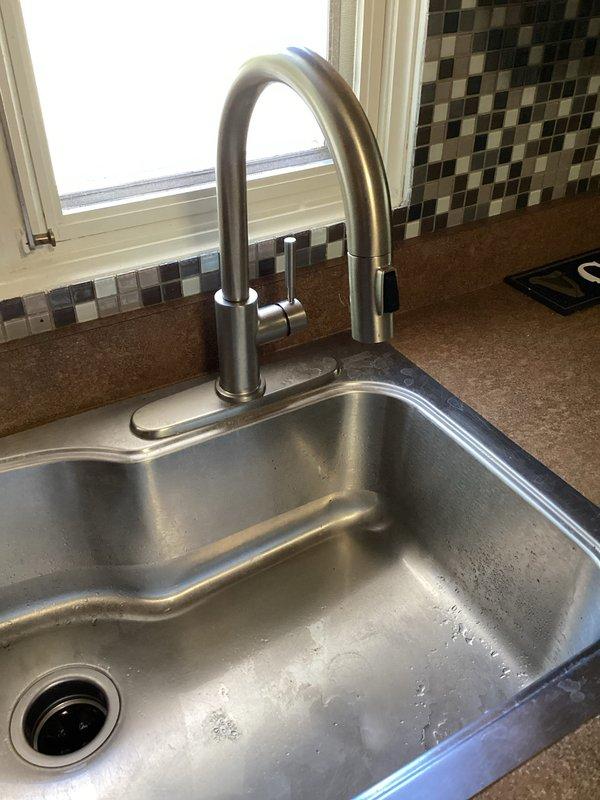 Responded to callback regarding low water pressure throughout house following previous repair. Inspected kitchen faucet installation and verified Delta brand faucet components were properly installed with secure connections to supply lines. Tested water flow and pressure at kitchen sink to diagnose system-wide pressure concerns. Scheduled shower faucet replacement to be addressed during upcoming service visit.