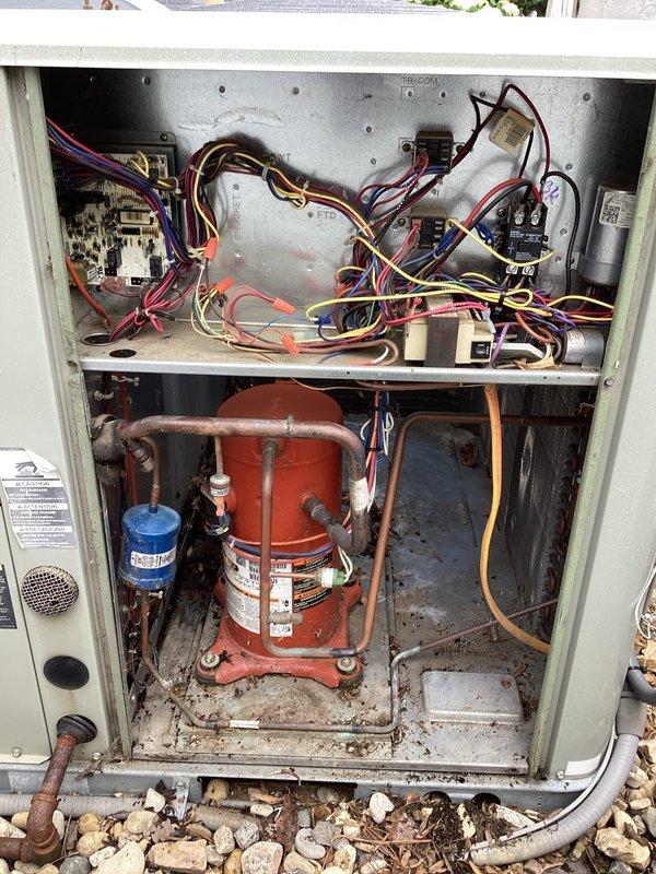 Completed scheduled air conditioning maintenance per HVAC membership plan. Performed comprehensive system inspection including electrical control panel examination, compressor assessment, and refrigerant line evaluation. Documented equipment condition with interior and control board photography showing operational components, wiring connections, and current system state. Unit operational with normal accumulation of debris noted in lower compartment and minor surface wear consistent with outdoor installation age.
