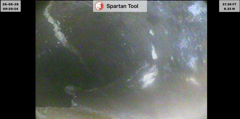 Completed main drain cleanout and inspection using camera equipment to assess second story drain line condition. Camera inspection revealed drain line status at approximately 27.30 feet depth, documenting interior pipe conditions and identifying routing path to basement stack connection. Provided quoted repair specifications for rerouting second story drain line to alternate stack location in basement as discussed.
