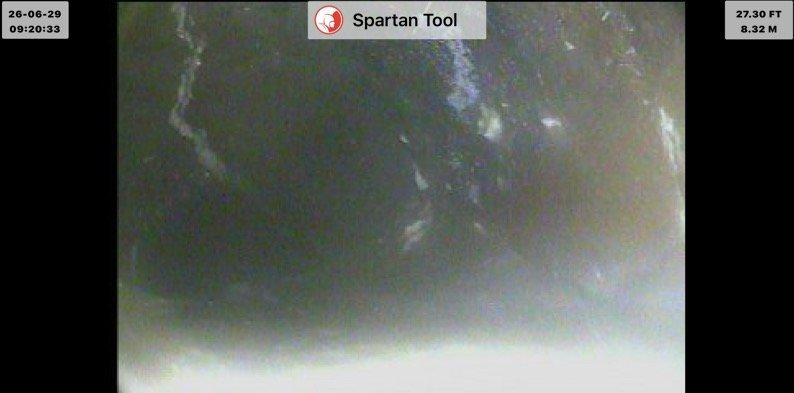 Completed main drain cleanout and inspection using camera equipment to assess second story drain line condition. Camera inspection revealed drain line status at approximately 27.30 feet depth, documenting interior pipe conditions and identifying routing path to basement stack connection. Provided quoted repair specifications for rerouting second story drain line to alternate stack location in basement as discussed.