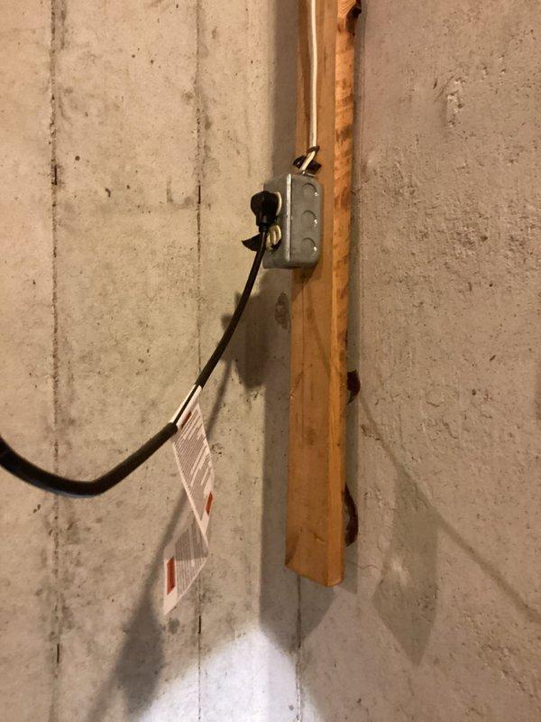 Responded to service call for non-operational sump pump serving basement bathroom with water accumulation on floor. Upon arrival, inspected sump pump basin installation with standing water present and confirmed pump failure with no electrical breaker trip indicated. Diagnosed complete pump malfunction, documented existing installation configuration including PVC discharge piping and electrical junction box setup, and performed necessary repairs to restore proper sump pump operation and drainage functionality.