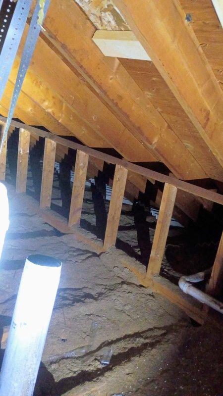Conducted site assessment and provided estimate for water heater exhaust pipe extension in 25-year-old residential property. Inspected attic space to determine routing requirements for extending existing exhaust vent pipe 4-5 feet through attic and roof structure. Previous exhaust pipe section had been removed during recent roof replacement work. Documented attic conditions including exposed wooden joists, insulation, and roof framing to plan proper venting pathway and penetration point through roof decking. Customer will supply all necessary materials for exhaust pipe extension and cap installation.