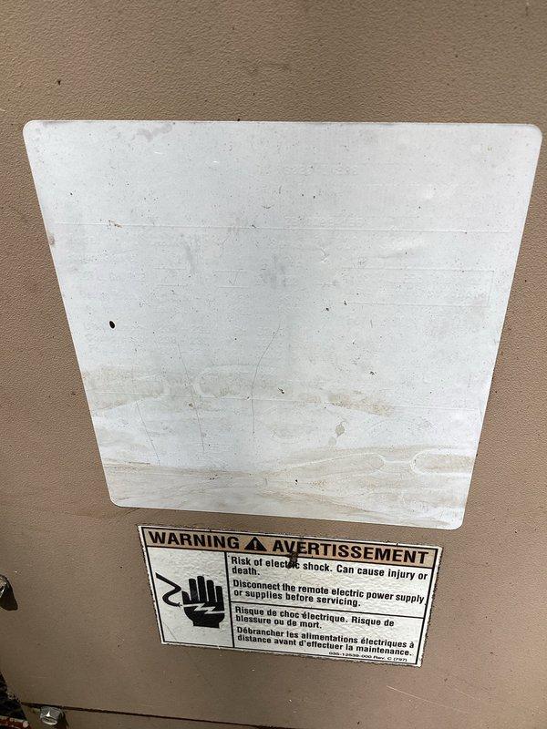 Responded to no cooling call on 10+ year old residential air conditioning system. Upon arrival, performed diagnostic testing on outdoor condenser unit using electrical testing equipment to assess compressor and fan motor operation. Identified system failure preventing cooling operation. Documented equipment condition including weathered fan guard with visible rust and corrosion on aging unit. Verified electrical disconnect and safety labeling present at indoor air handler location. Completed diagnostic evaluation and provided customer with repair recommendations for restoring system functionality.