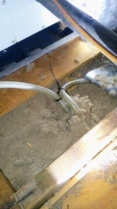 Responded to complaint of thumping sound from recently installed air conditioning unit in attic hallway. Inspected attic-mounted system and identified noise source as improperly secured flexible ductwork vibrating against wooden framing members during operation. Repositioned and secured flexible HVAC ducting with appropriate metal fasteners and clamps to eliminate contact with structural components. Verified proper clearances between ductwork and framing throughout accessible attic space. Tested system operation and confirmed elimination of thumping noise. Unit now operating quietly and returned to normal service.