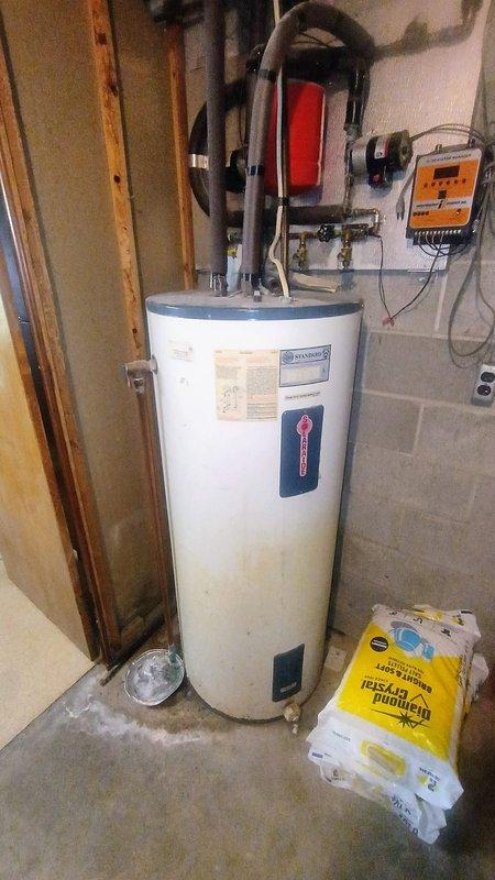 Responded to service call regarding malfunctioning water softener system. Upon arrival, conducted thorough inspection of basement utility area and water treatment equipment. Examined heavily corroded water softener tank showing significant rust accumulation and surface deterioration. Inspected all valve connections, gauges, and plumbing fittings associated with the softener system. Evaluated copper supply lines and distribution piping for proper operation. Assessed pressure tank condition and verified gauge readings. Examined filter cartridge system and noted maintenance requirements. Photographed equipment condition for documentation purposes. Provided customer with diagnostic findings regarding the deteriorated state of the water softener tank and recommended replacement options due to extensive corrosion and age-related wear compromising system integrity and performance.