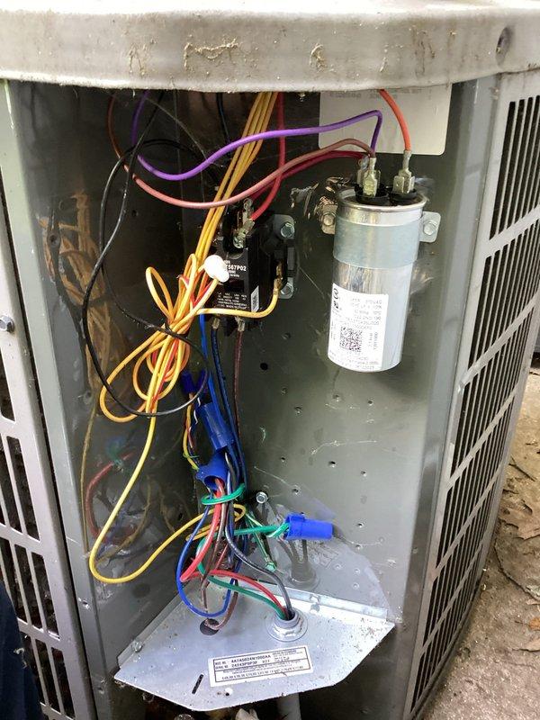 Completed planned duo maintenance on two HVAC systems with ages of 6 months and 15 years. Performed comprehensive inspection of outdoor condenser units, including examination of electrical components, capacitors, wiring connections, and overall system operation. Documented equipment condition with photos showing access to electrical compartment and component testing procedures, confirming both systems are functioning properly for continued operation.