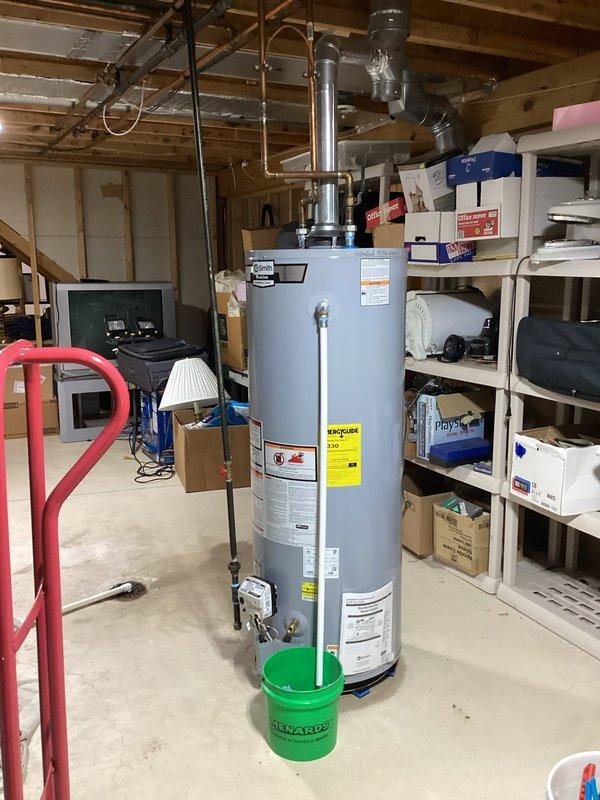 Installed a new 50-gallon A.O. Smith natural gas automatic storage water heater (Model GCG-50 400, 40,000 BTU/HR input) in basement utility area. Completed all necessary water supply connections, gas line hookup, and venting installation per manufacturer specifications and local code requirements. Discussed and obtained approval for any required piping modifications and code upgrades with customer prior to commencing work.