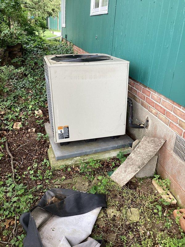 # HVAC Service Report

Responded to no cooling complaint on 29-year-old residential air conditioning system. Upon arrival, performed visual inspection of outdoor condensing unit, which showed significant age-related deterioration including weathered cabinet, oxidized refrigerant lines, and corroded frame components. Unit was positioned on concrete pad with evidence of long-term environmental exposure and minimal recent maintenance.

Given the system's age of 29 years—well beyond the typical 15-20 year service life of residential AC equipment—and the extent of visible wear, advised customer that system has reached end of useful life. Documented equipment condition with photographs showing deteriorated insulation, corroded copper lines, and overall weathering. Recommended full system replacement rather than repair due to age, declining efficiency, and likelihood of additional component failures. Provided customer with replacement options and efficiency upgrade information for modern equi