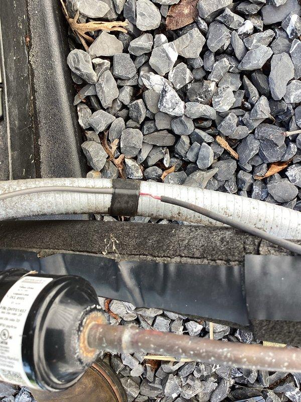 Responded to no cooling complaint on 5-year-old residential air conditioning system blowing warm air with adequate airflow and no ice buildup present. Diagnosed failed compressor contactor and defective dual run capacitor preventing compressor operation. Replaced faulty contactor with new 30-amp single-pole unit and installed manufacturer-specified dual run capacitor. Completed electrical connections with proper wire nuts, verified secure terminations at outdoor condensing unit, tested system operation with compressor engaging properly, and confirmed cold air delivery at supply registers.