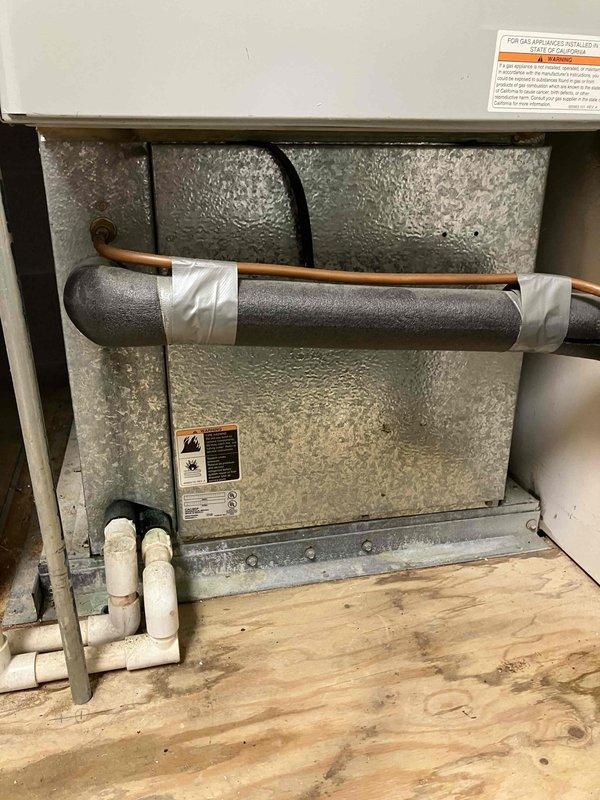Completed comprehensive tune-up and diagnostic evaluation on 26-year-old Carrier heating and cooling system with reports of hot air blowing from vents. Performed standard maintenance protocol including inspection of air handler, furnace cabinet, refrigerant lines with foam insulation, condensate drain system with PVC piping, and ductwork connections. All components were assessed for proper operation, with system found to have adequate airflow and no ice buildup present at time of service.
