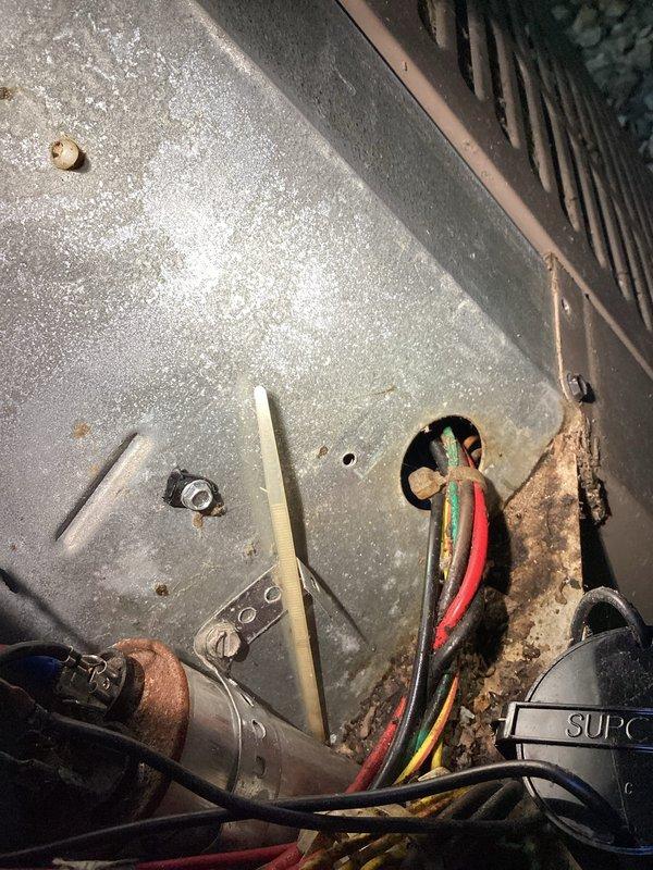 Responded to no cooling complaint on 14-year-old AC system with 2-year-old furnace where homeowner reported minimal airflow through vents and ice buildup on refrigerant line. Upon arrival, found outdoor unit with exposed low-voltage wiring at rooftop condenser requiring immediate attention for safety and proper operation. Performed complete system diagnostic including electrical connections, refrigerant pressures, and airflow verification at indoor air handler in basement mechanical room. Addressed ice formation issue by confirming system had been properly thawed per pre-arrival instructions, then identified root cause of cooling failure and restored system to normal operating condition.