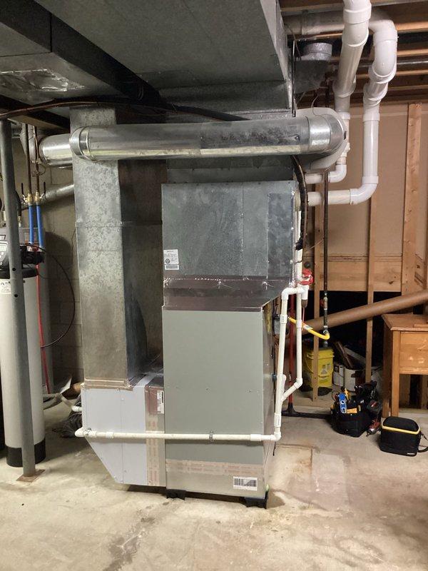 Responded to no cooling complaint on 14-year-old AC system with 2-year-old furnace where homeowner reported minimal airflow through vents and ice buildup on refrigerant line. Upon arrival, found outdoor unit with exposed low-voltage wiring at rooftop condenser requiring immediate attention for safety and proper operation. Performed complete system diagnostic including electrical connections, refrigerant pressures, and airflow verification at indoor air handler in basement mechanical room. Addressed ice formation issue by confirming system had been properly thawed per pre-arrival instructions, then identified root cause of cooling failure and restored system to normal operating condition.