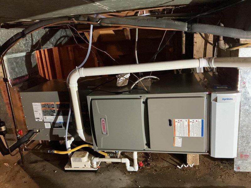 Completed full HVAC system installation in crawl space including ML196UH070 horizontal furnace, ML13KC1-030 condensing unit, and CK40HT-36B evaporator coil. Installed condensate pump with PVC drain lines, connected yellow flexible gas line to furnace, and configured new thermostat. Verified proper airflow measurements, confirmed filter specifications, and tested all system operations to ensure equipment functionality and compliance with manufacturer specifications.