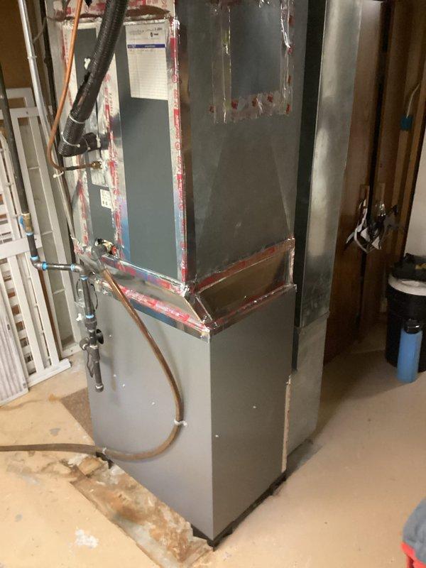 Completed installation of ML180UH090 furnace unit in basement utility area. Reused existing filter rack and thermostat from previous system. Confirmed presence of chimney liner for proper venting. Connected all necessary ductwork, gas lines, and electrical components per manufacturer specifications. System tested and operational upon completion.