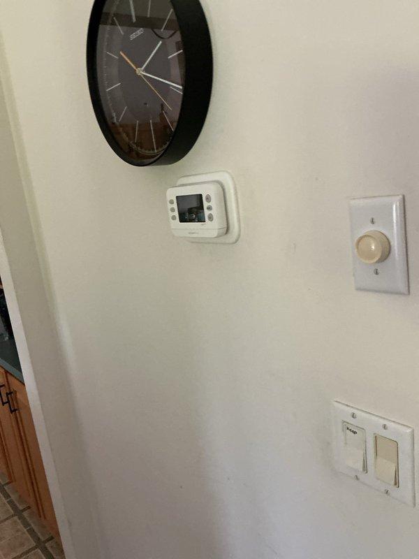 Completed full HVAC system installation including furnace model EL297UH070, air conditioning unit ML17KC2-036, and evaporator coil CK40CT-48B. Installed whole-house humidifier model 1610 integrated into the furnace plenum system with proper ductwork connections. Mounted and programmed digital thermostat S200 for system control. All equipment installed to manufacturer specifications with proper condensate drainage, PVC venting, and electrical connections. System tested and operational upon completion.