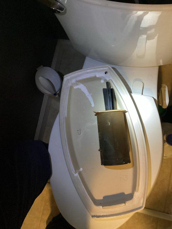 Responded to basement bathroom for toilet repair. Upon inspection, found the flush valve cylinder lift mechanism had broken off inside the tank. Removed toilet tank lid and assessed internal components. Flapper valve and float assembly were intact but cylinder lift arm was fractured and non-functional. Replaced defective cylinder lift assembly with new component. Tested flush mechanism for proper operation and verified complete tank refill cycle. Toilet restored to full working condition.