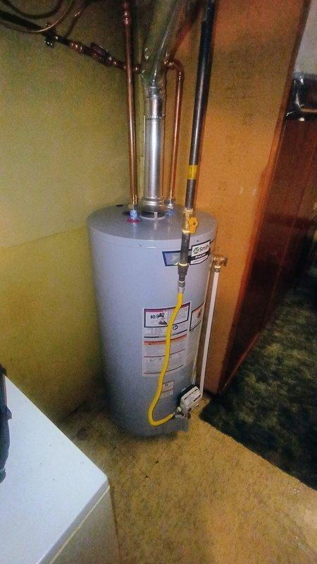 Completed installation of 40-gallon residential water heater in office utility closet per approved quote. Removed existing unit and installed new water heater with proper copper piping connections for hot and cold water lines, secured yellow flexible gas line with appropriate metal fittings, and ensured all manufacturer specifications and safety requirements were met. All plumbing connections tested and verified operational with no leaks detected.