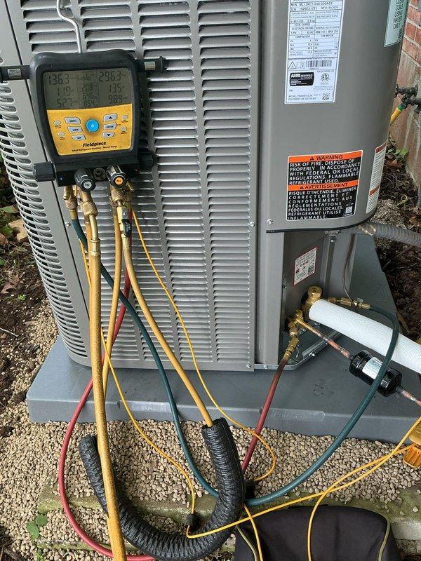 # HVAC Install - A/C Only

Installed new Lennox 3-ton air conditioning system consisting of ML13KC1-036 outdoor condensing unit and CK40CT-30B indoor evaporator coil. Unit positioned on concrete pad in side yard area with proper clearances maintained from brick wall and surrounding structures. Mounted new disconnect box to brick wall with appropriate conduit and electrical connections routed to outdoor unit. Reused existing thermostat and RDS board from previous system, verifying compatibility and proper communication with new equipment. 

Completed refrigerant line connections between indoor and outdoor components, evacuated system to manufacturer specifications, and charged unit with proper refrigerant type and quantity. Connected and tested all electrical connections including power supply, control wiring, and safety circuits. Performed system startup procedures and utilized digital manifold gauges to verify operating pressures and temperatures within normal parameters. Confirmed pr