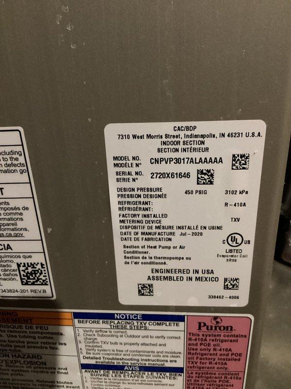 Responded to service call for condensation buildup and water leak on Carrier/BDP evaporator coil unit (Model: CNPVP3017ALA4AAA, Serial: 272DX61646). Inspected internal components and control board, confirmed R-410A refrigerant system with factory-installed TXV metering device, and documented equipment condition with photos for customer records.