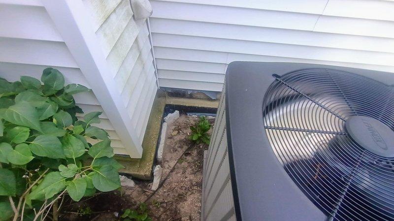 Responded to service call for heat pump unit evaluation due to settlement concerns. Upon arrival, found one-year-old outdoor heat pump unit had settled approximately two inches on backside, causing unit to be out of level. Documented current condition with photographs from all sides of equipment and placed level on unit in multiple directions to capture degree of unlevel positioning. Unit remained operational with no immediate performance issues noted. Consulted with management while on-site to assess structural concerns and determine appropriate corrective action plan for pad stabilization.