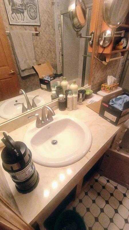 Installed customer-supplied brushed nickel bathroom faucet with matching handles on existing vanity sink per quoted specifications. Verified proper water flow, tested drain assembly operation, and confirmed no leaks at supply line connections upon completion.