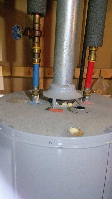 Responded to water leak call regarding exterior pipe with hole ejecting water when sump pump activates. Upon arrival, inspected exterior plumbing system partially obscured by dense vegetation near building foundation. Located damaged black flexible discharge line connected to sump pump system with visible hole causing water ejection during pump cycle. Assessed water heater and associated plumbing connections in mechanical room to verify no additional leaks in system. Documented condition of damaged sump pump discharge pipe and surrounding equipment. Water service remained on during inspection as no standing water was present and leak was isolated to exterior discharge line during pump operation only.