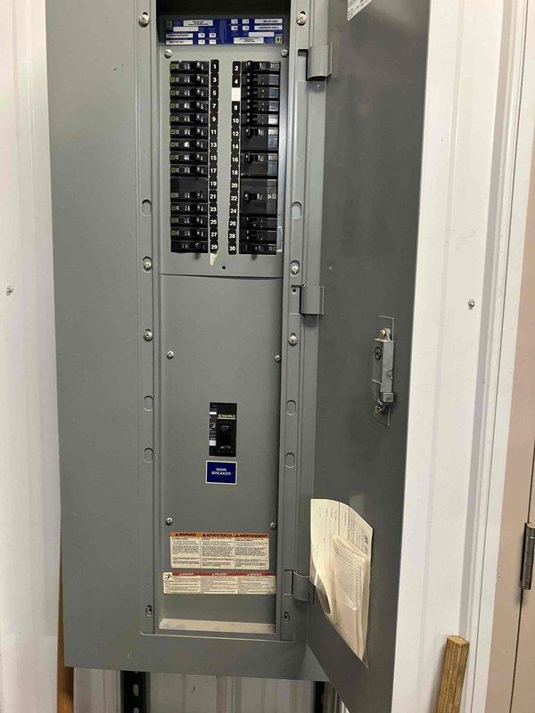 Conducted site assessment of existing air conditioning system experiencing refrigerant leak. Documented current outdoor condenser unit, electrical disconnect, and main electrical panel configuration through photographic documentation. Provided estimate for complete HVAC system replacement based on observed equipment age and refrigerant loss issues.