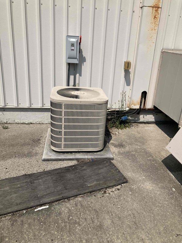 Conducted site assessment of existing air conditioning system experiencing refrigerant leak. Documented current outdoor condenser unit, electrical disconnect, and main electrical panel configuration through photographic documentation. Provided estimate for complete HVAC system replacement based on observed equipment age and refrigerant loss issues.
